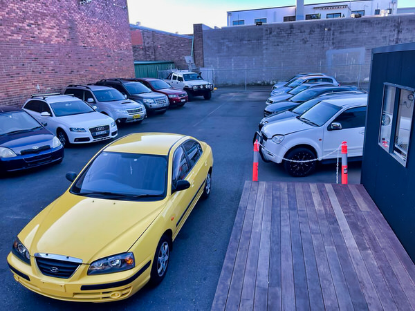 We Buy Sydney Cars for Cash - photo showing the yard full of cars where we buy used vehicles in Sydney