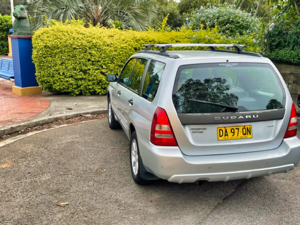 Sell use Subaru for cash - photo showing the rear passenger side angle view of a used Subaru recently purchased from a customer at We Buy Sydney Cars depot in Botany