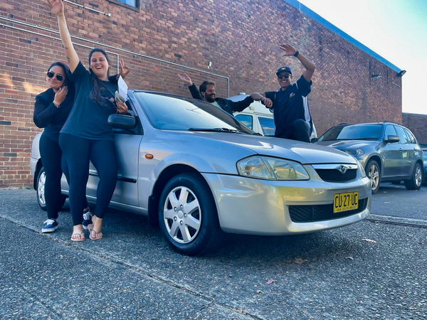 Sell your car the easy way - photo of two customers who sold their car to we buy sydney cars today